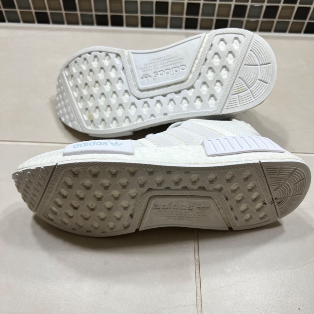 white nmds with blue